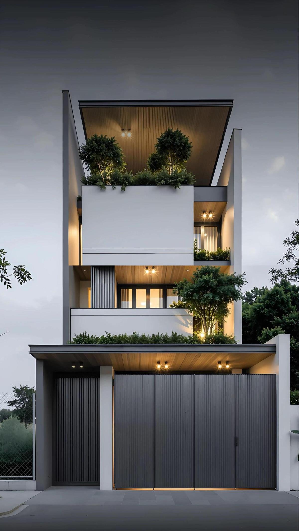 3Mặt tiền nhà phố 3.5 tầng tại Bắc Giang gây ấn tượng bởi những khối hộp so le, kết hợp cùng mảng xanh thẳng đứng và hệ nan nhôm hiện đại.